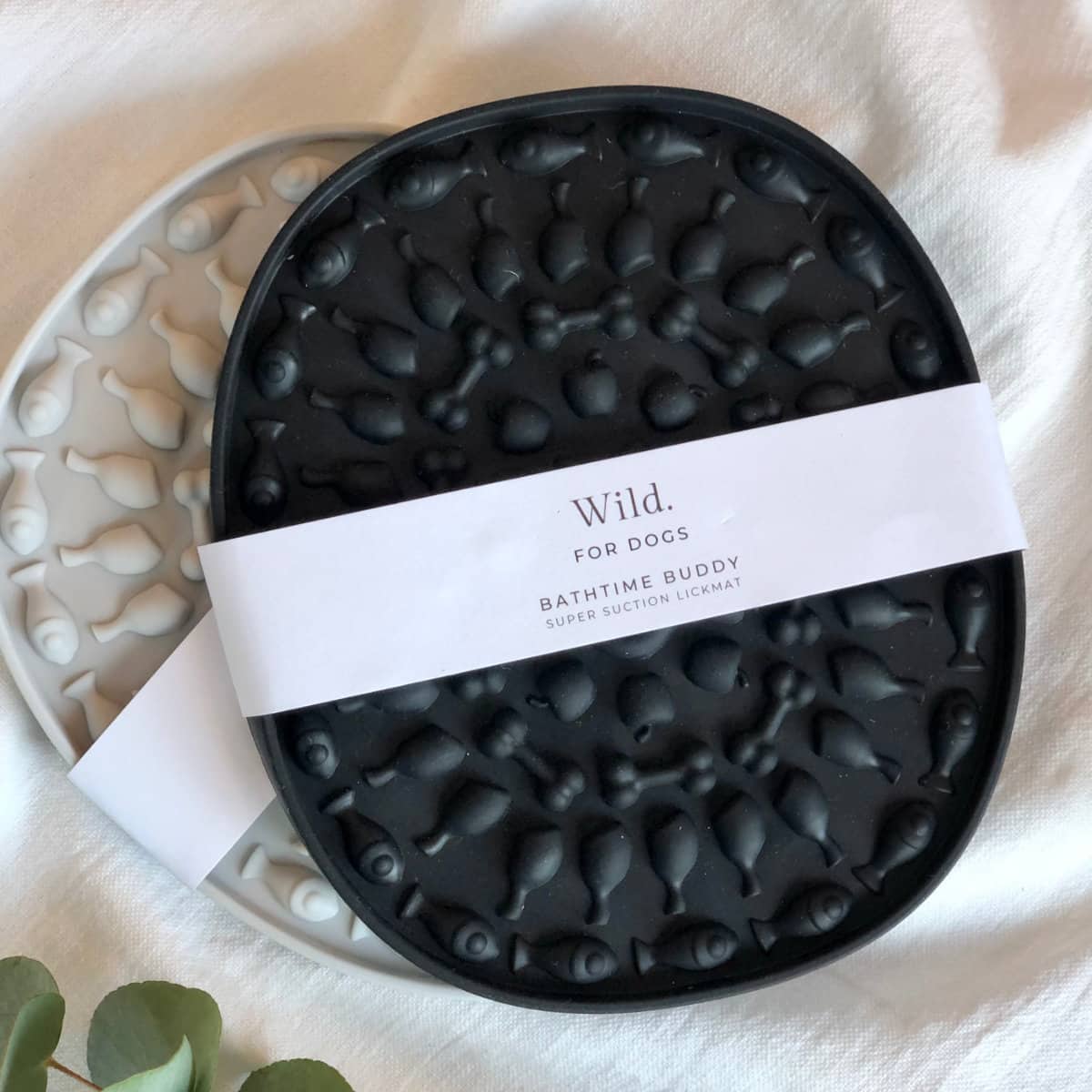 Black and grey oval silicone suction lickmats with bone and fish pattern, Wild For Dogs Bathtime Buddy