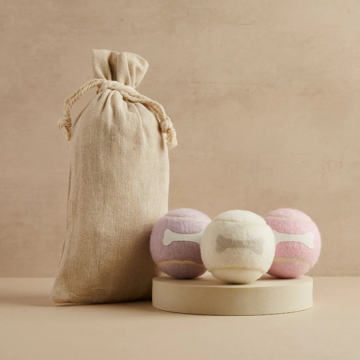 Three tennis balls in lavender, cream and pink with bone design and linen bag, Pet Hamper