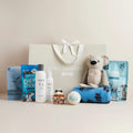 Lux Birthday Boy dog hamper with plush koala, shampoo, chew sticks, cupcake toy, blanket, tennis ball, dental treats and gift bag