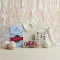 Pawty Time dog birthday hamper with cake mix, tennis balls, cupcakes, rope bone, greeting card and gift bag, tinsel backdrop