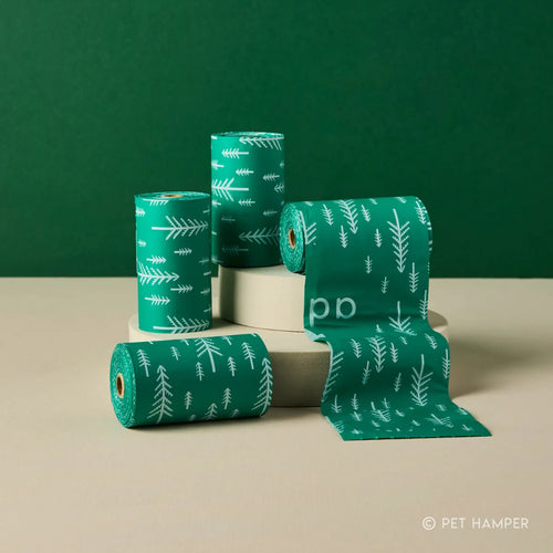 Green Adios Christmas compostable dog poo bags with pine tree print roll, single roll