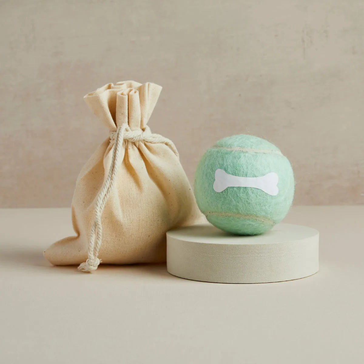 Mint green tennis ball with white bone design and linen bag, Pet Hamper