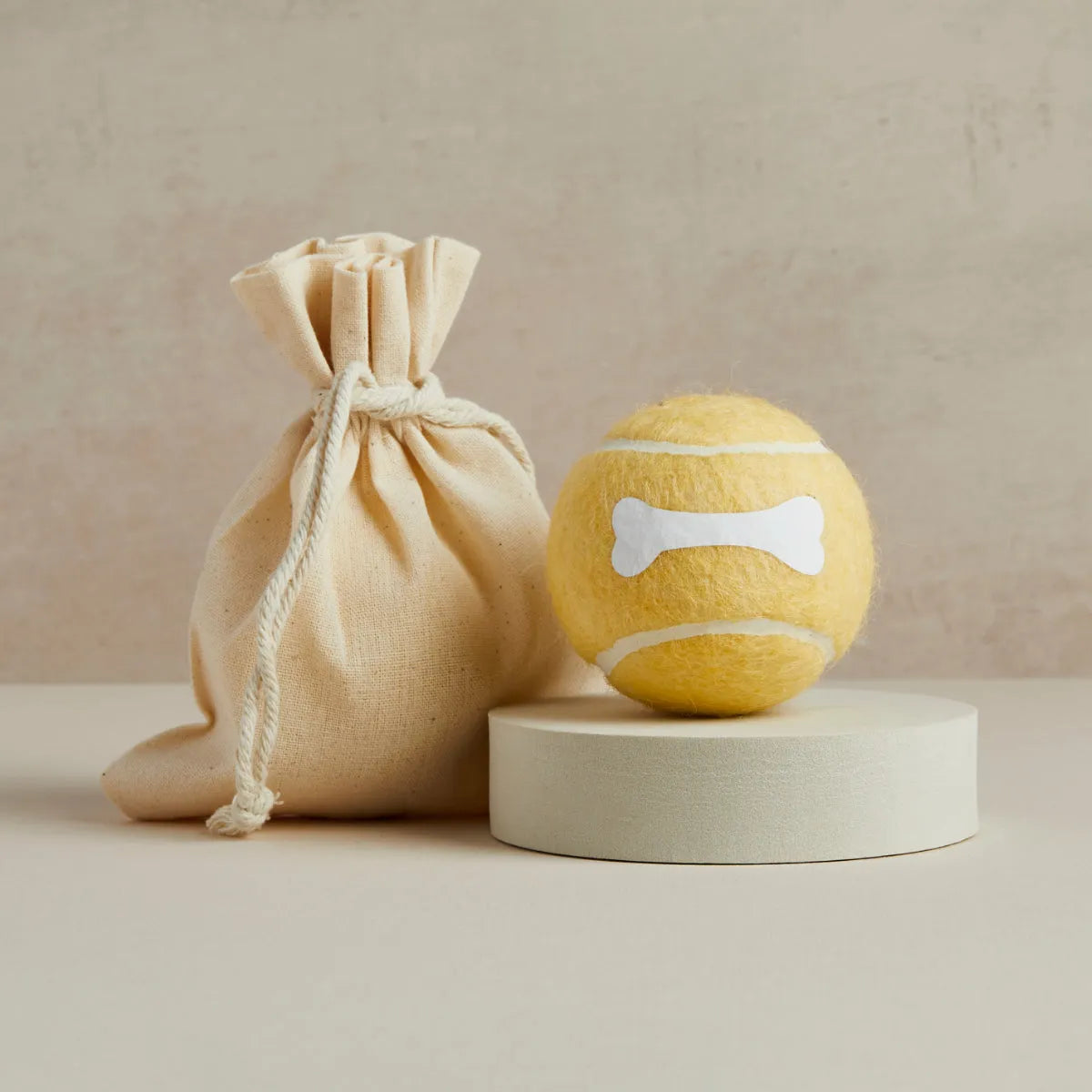 Yellow tennis ball with white bone design and linen bag, Pet Hamper